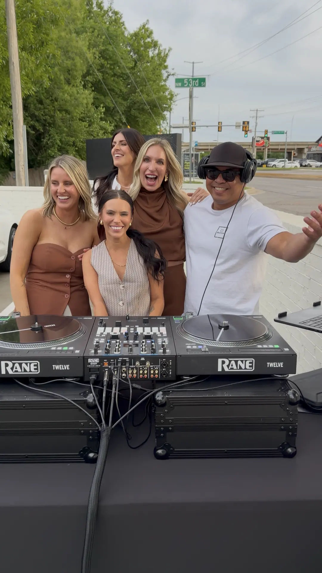 DJ Pillow Puff with guests at an outdoor business event on NW 53rd Street in Oklahoma City